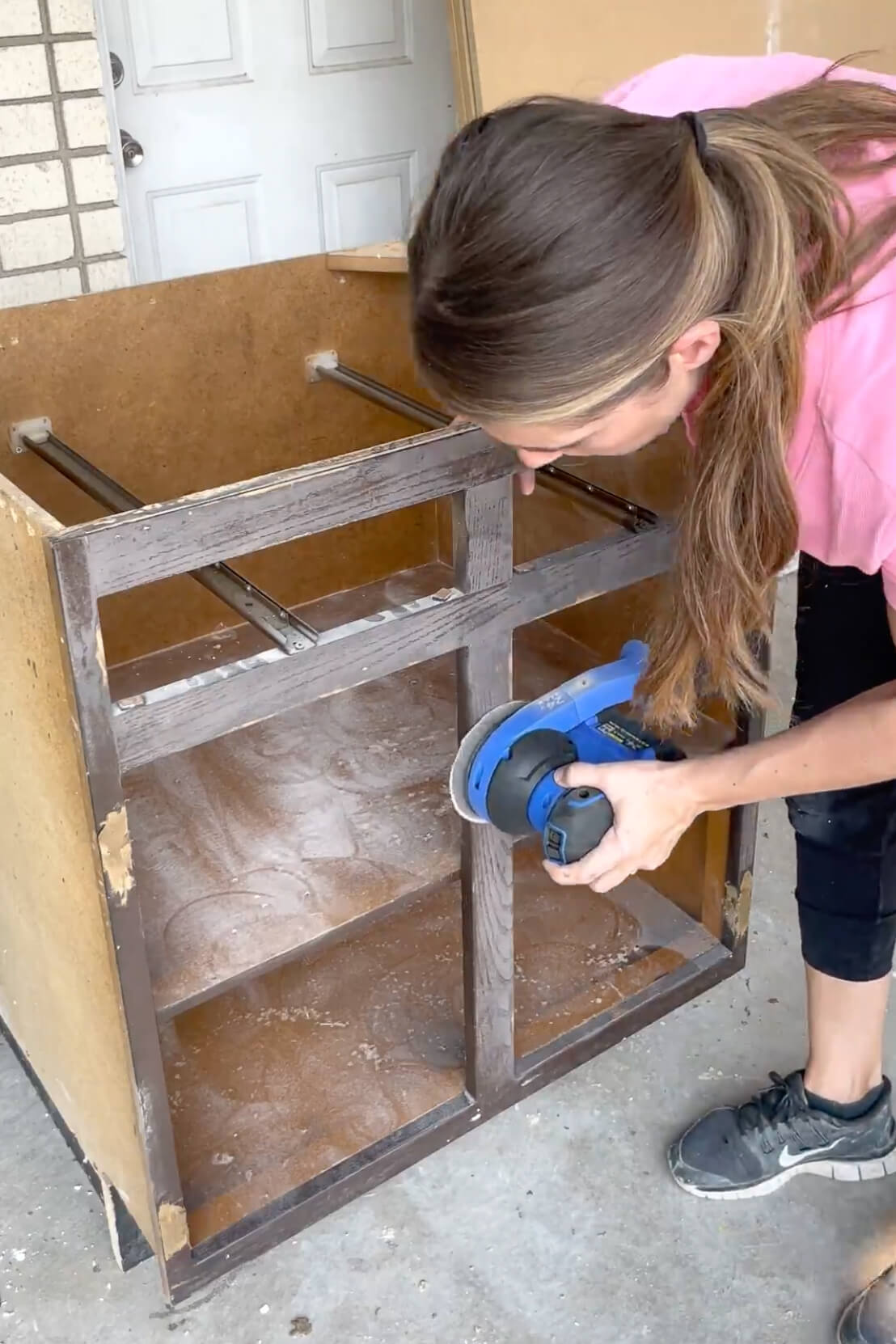 Prepping cabinets for painting.